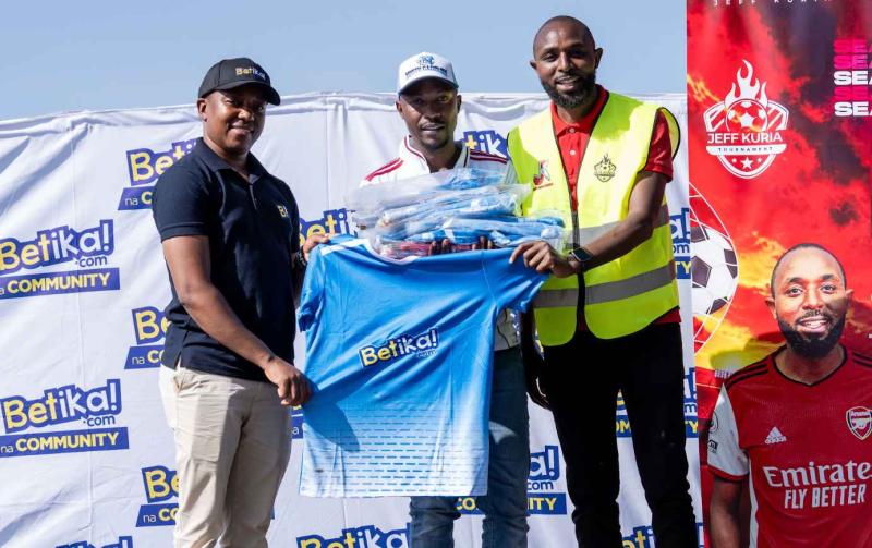 Jeff Kuria poses for a photo while giving out merchandise during the Jeff Kuria tournament in Kiambu County.